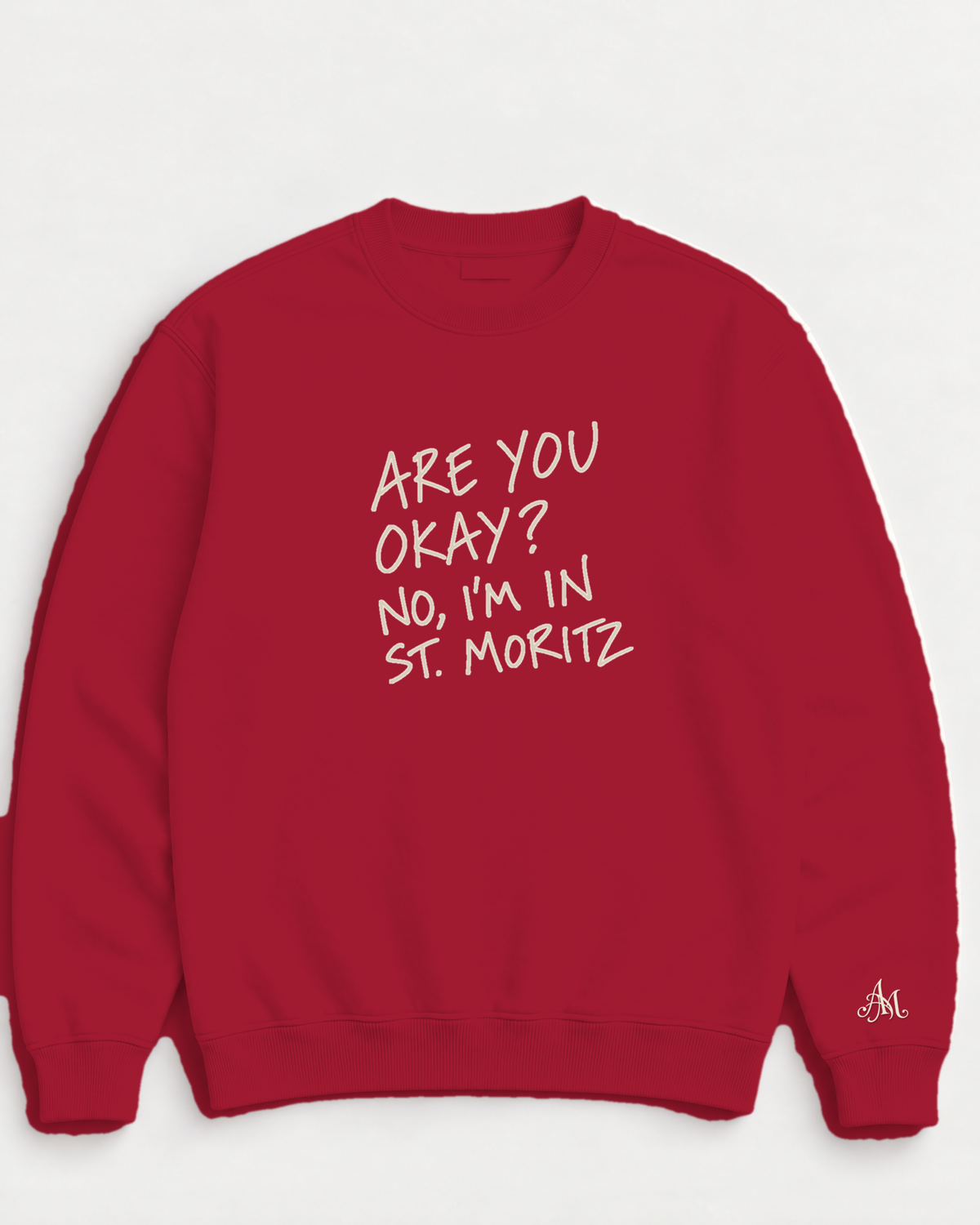 Ruby Red crewneck sweatshirt with embroidered Are You Okay? No, I'm In St. Moritz