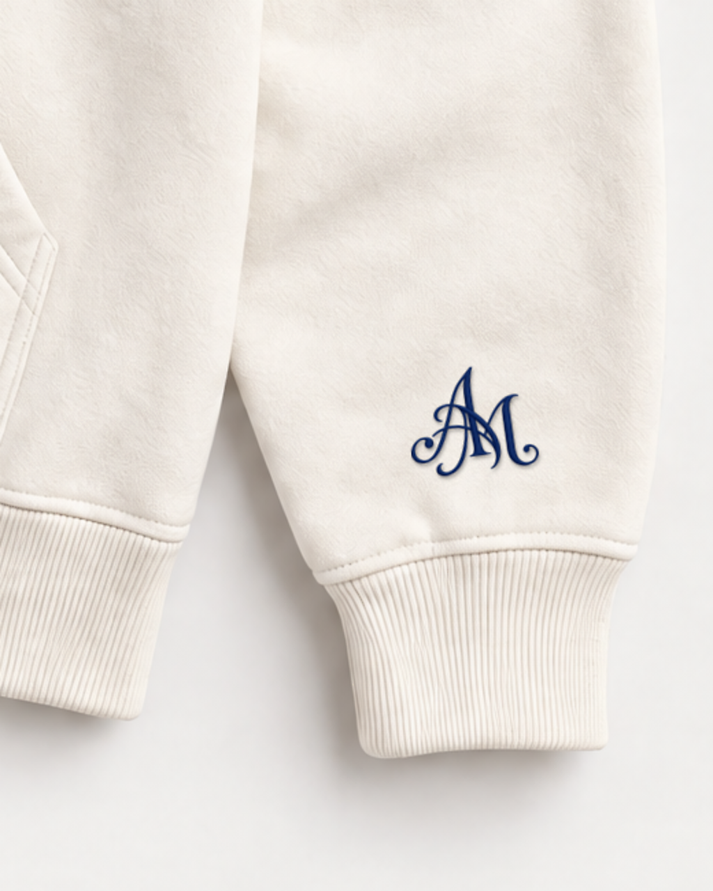 Close-up of the AM monogram on the left sleeve