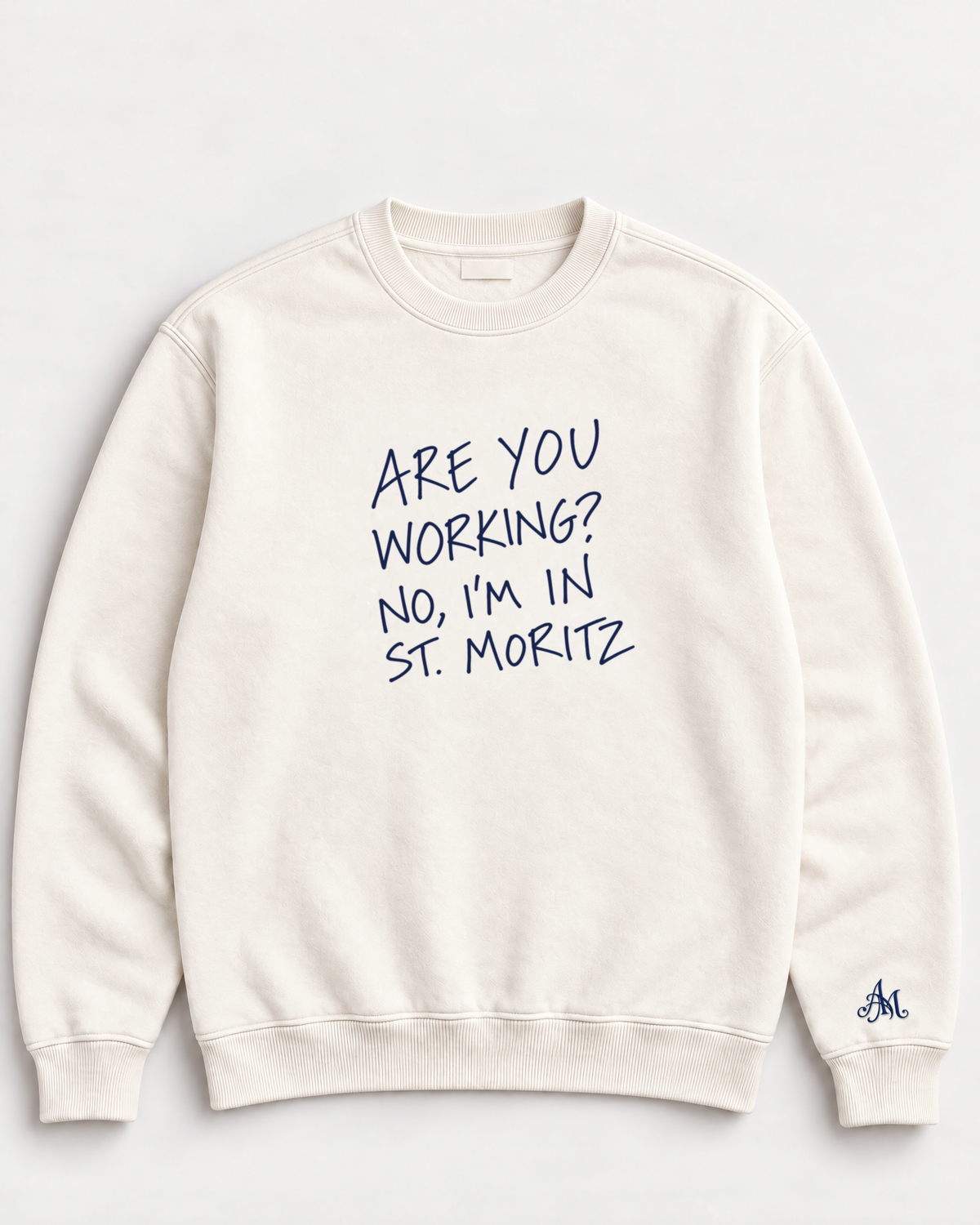 Cream crewneck sweatshirt with embroidered Are You Working? No, I'm In St. Moritz