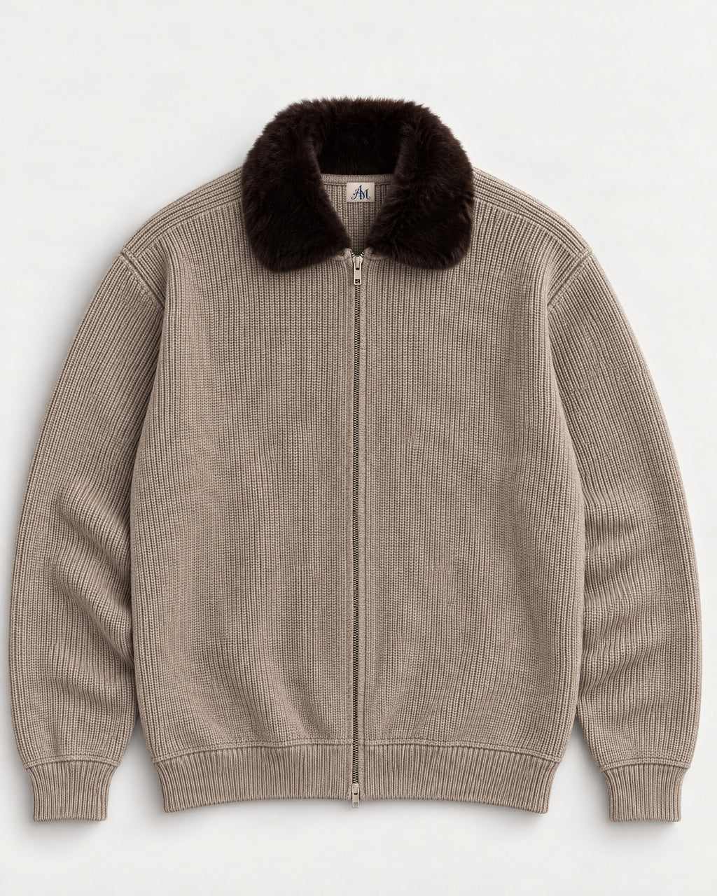 The Engadin Zip Knit in taupe with dark faux-fur collar and woven AM neck label, front view