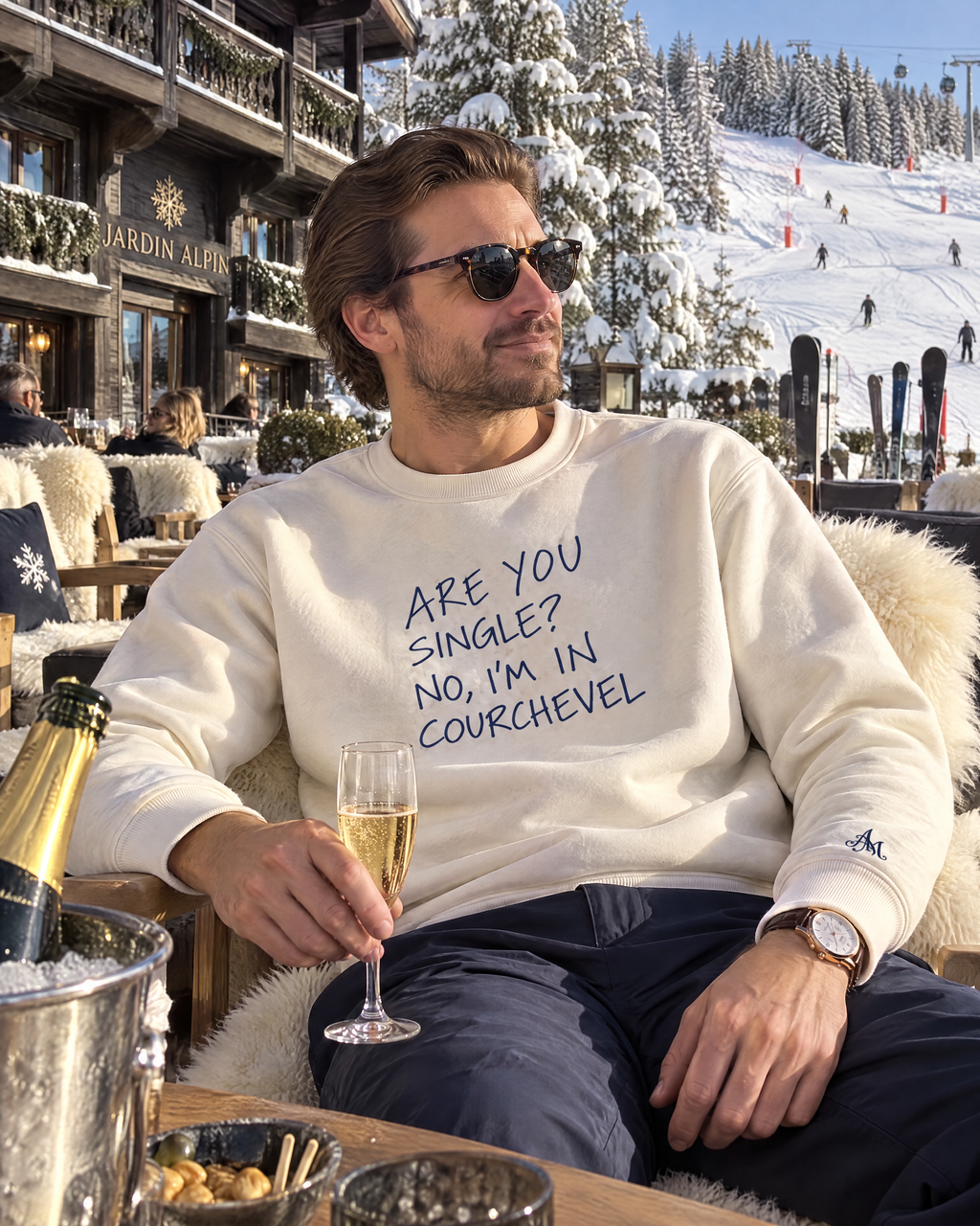 Cream crewneck Are You Single? on a hotel terrace at Jardin Alpin, Courchevel 1850