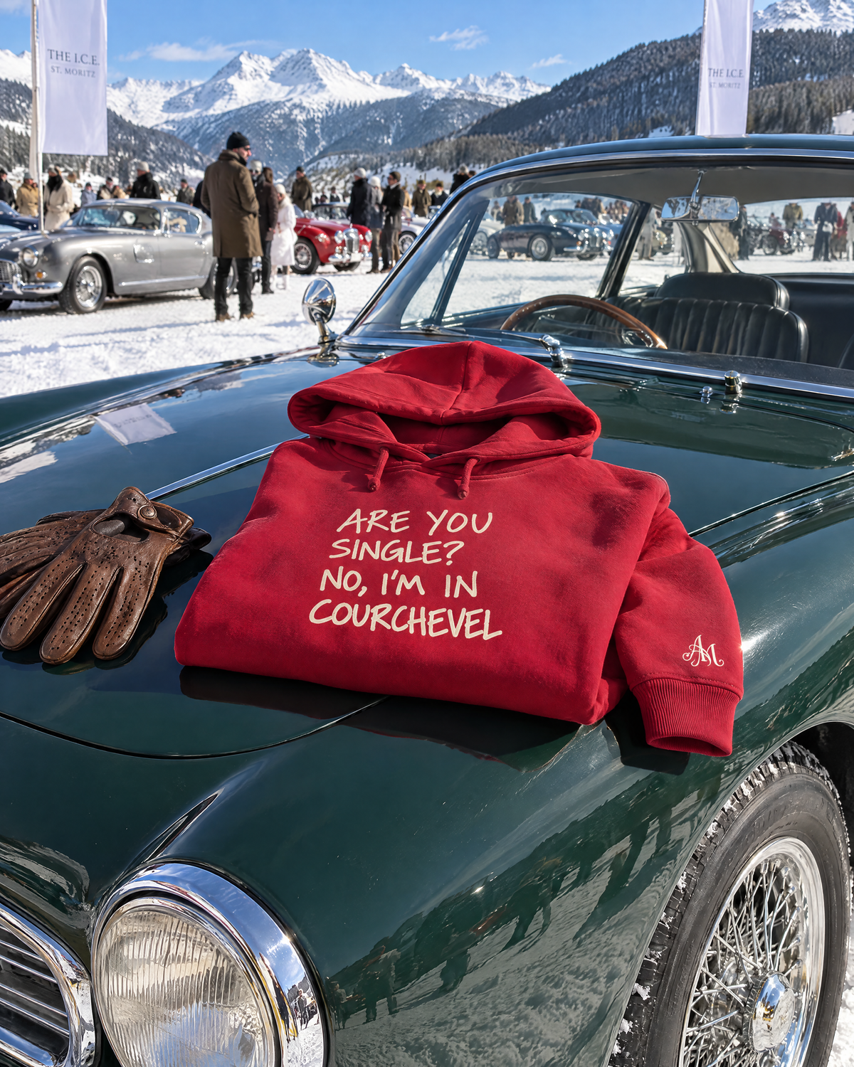 Ruby red hoodie on a classic car at The I.C.E. St. Moritz
